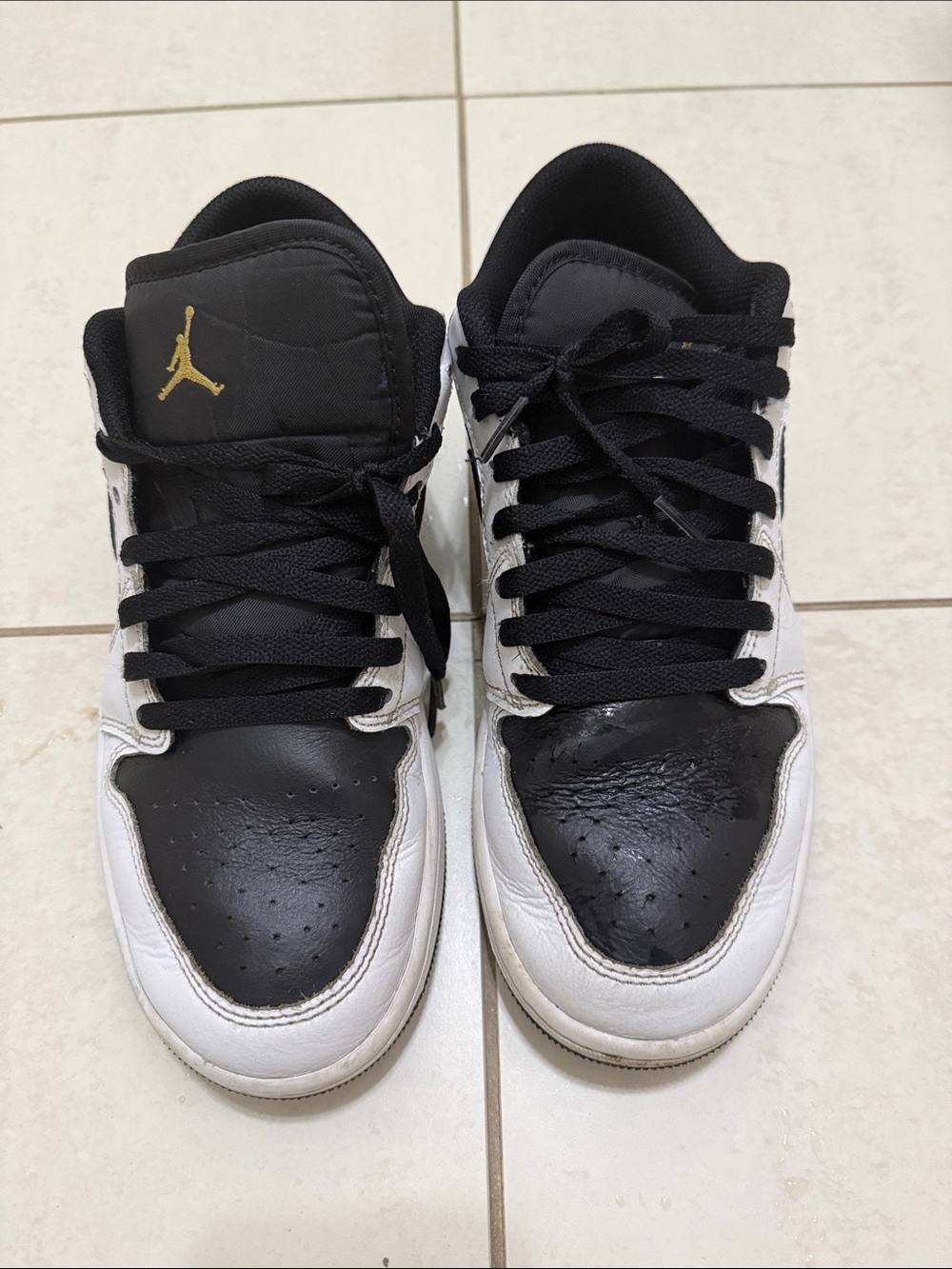 Air Jordan Black, White & Gold Low-Top Sneakers Iconic design